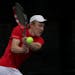 Scott Elsass, Eden Prairie's No. 1 tennis player, is nursing a bad knee and has to limit himself to doubles but hopes to be healthy in time for sectio
