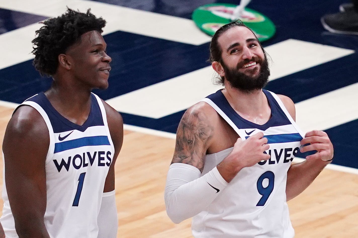 Minnesota Timberwolves guard Anthony Edwards (1) and Minnesota Timberwolves guard Ricky Rubio (9) joked with each other as they took the court after a timeout in the first quarter. ] ANTHONY SOUFFLE • anthony.souffle@startribune.com