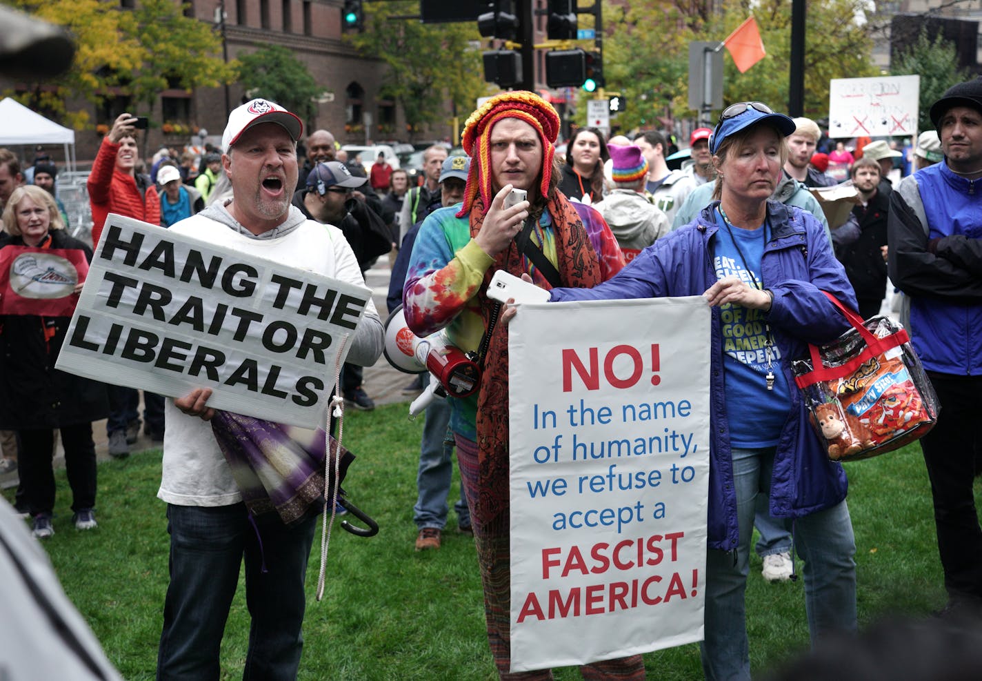 Protesters and supporters of the President gathered outside the Target Center Thursday afternoon before a Rally for President Trump.