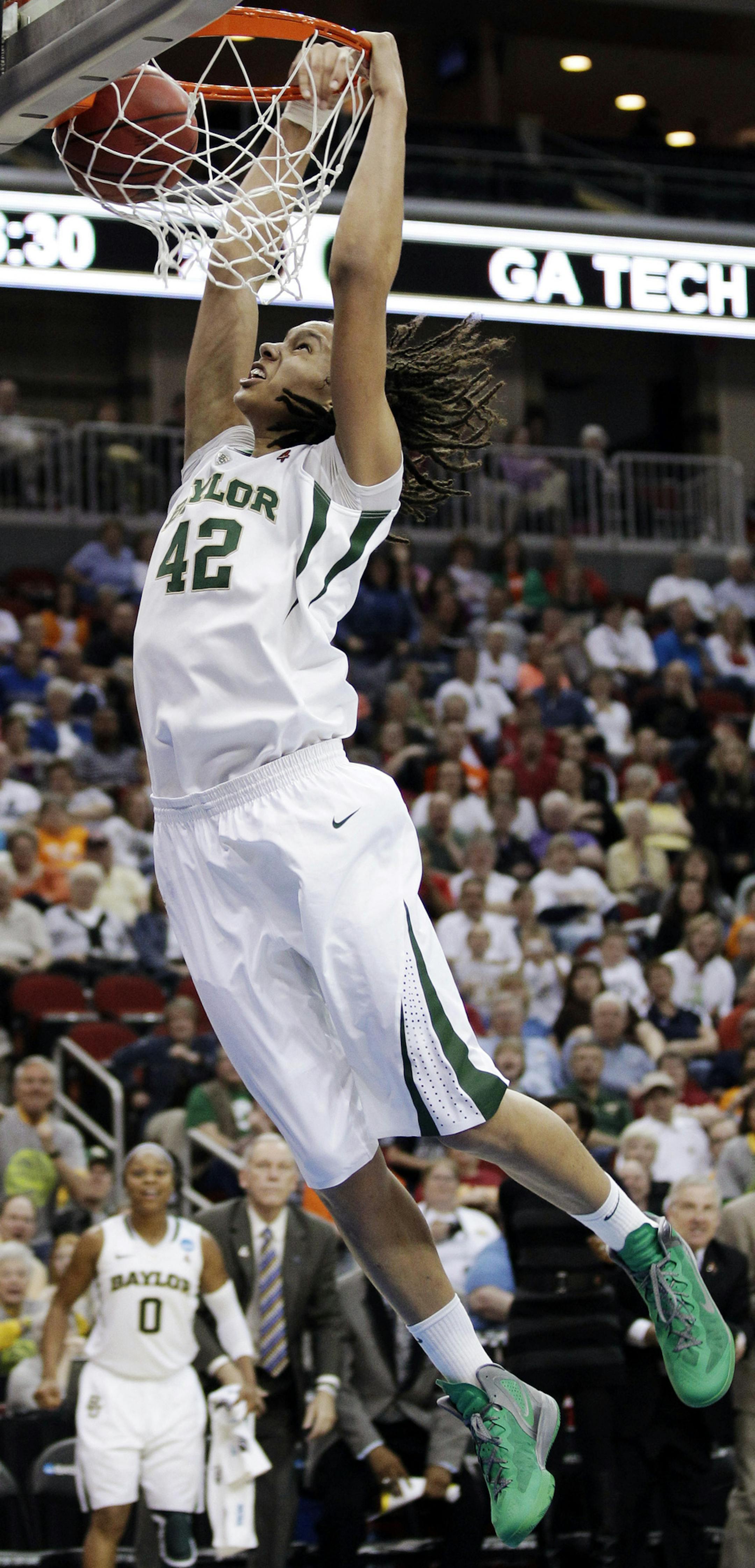 FILE - In this March 24, 2012, file photo, Baylor center Brittney Griner dunks the ball during the second half of an NCAA women's tournament regional semifinal college basketball game against Georgia Tech in Des Moines, Iowa. President Barack Obama is going with Griner and Baylor to win back-to-back titles in the NCAA women's basketball tournament. Obama's pick was announced Friday, March 22, 2013 on ESPN. (AP Photo/Charlie Neibergall, File) ORG XMIT: NY158