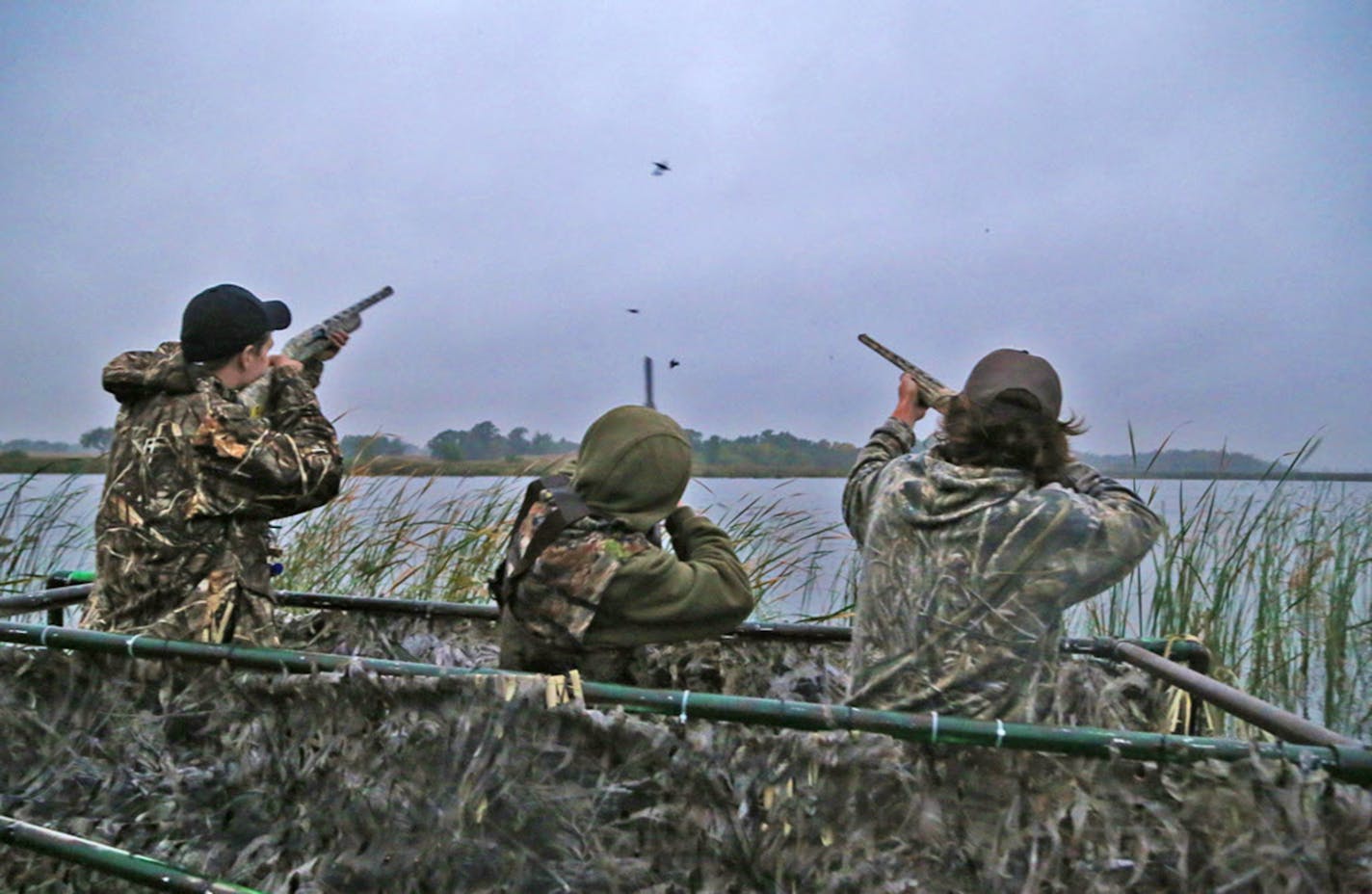 Trevor Unruh, left, Riley Mcalpine and Ryder Beckman drew down on a few blue-winged teal during the opener of the 2016 Minnesota duck season. An estimated 80,000 waterfowlers will be scattered about the state for Saturday's 2019 opener.