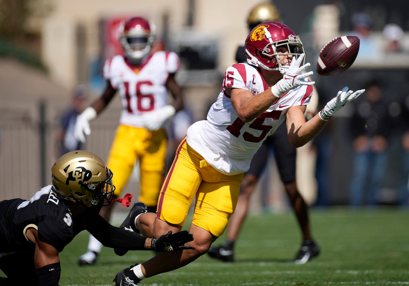 FILE - Southern California wide receiver Drake London, right, pulls in a pass as Colorado cornerback Christian Gonzalez defends during the first half of an NCAA college football game Oct. 2, 2021, in Boulder, Colo. London was named The Associated Press Pac-12 Offensive Player of the Year. (AP Photo/David Zalubowski, File)