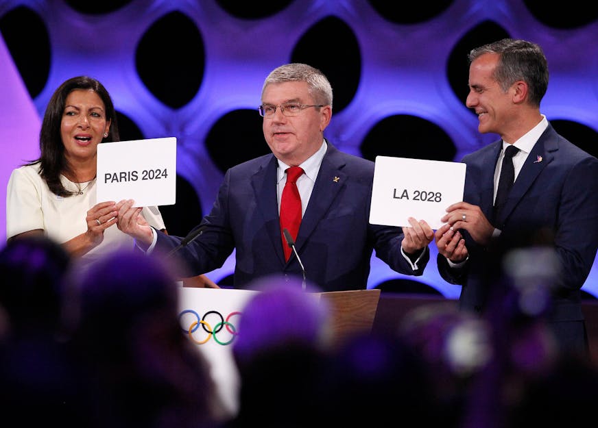 International Olympic Committee President Thomas Bach, center, poses for photos with Anne Hidalgo, left, Mayor of Paris, and Eric Garcetti, Mayor of Los Angeles, at the 131st IOC session in Lima, Peru, on Sept. 13, 2017. The International Olympic Committee (IOC) has confirmed Paris and Los Angeles as the Summer Olympics host cities for 2024 and 2028 respectively, through a vote by a show of hands on Wednesday in Lima, Peru. (Luis Camacho/Xinhua/Sipa USA/TNS) ORG XMIT: 1211000