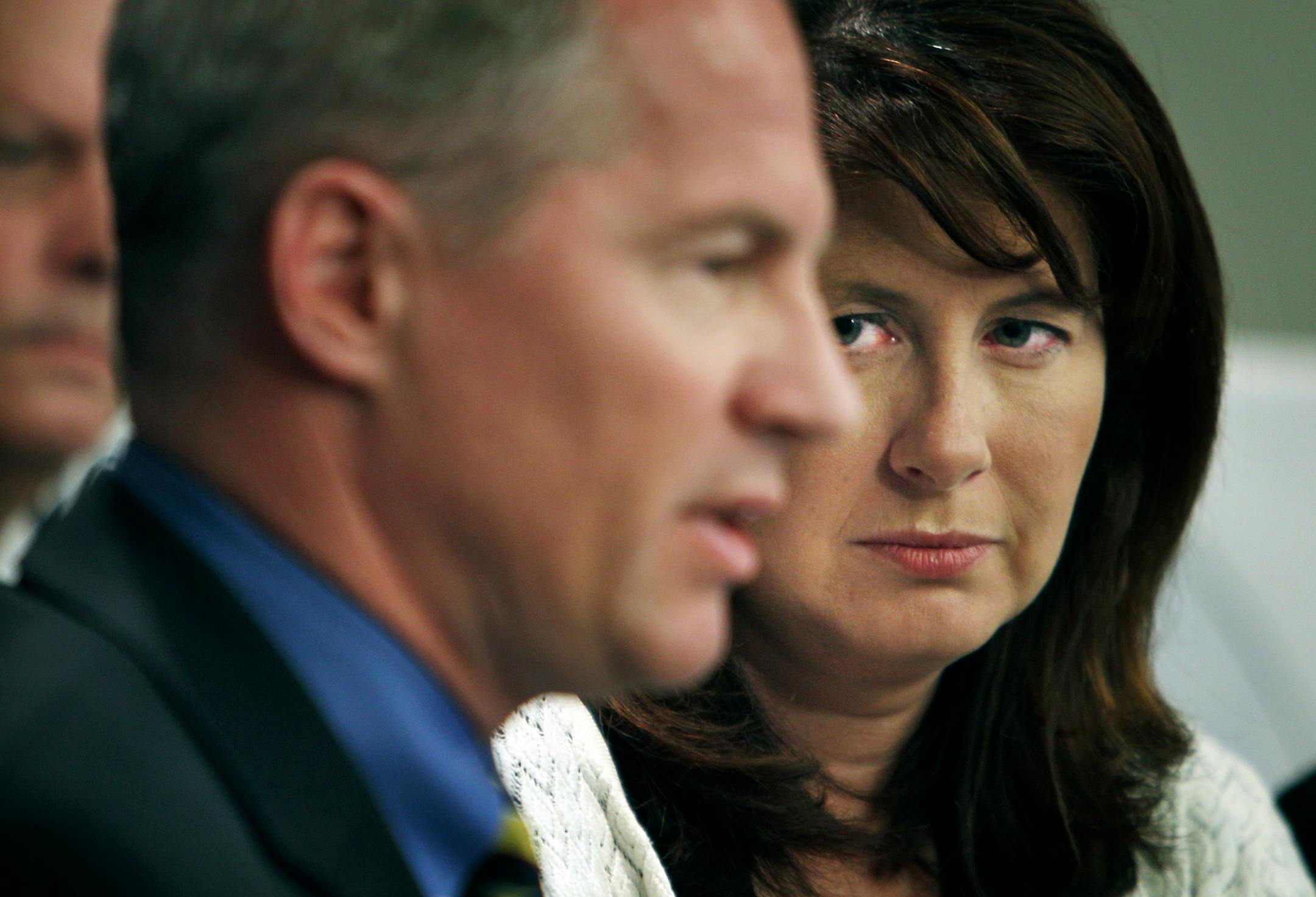 Sen. Geoff Michell, R-Edina, left, fields a question from a media member as Sen. Amy Koch, R-Buffalo, looks on.
