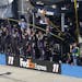 Denny Hamlin's crew cheers as Hamilin wins the NASCAR Aaron's 499 Sprint Cup series auto race at Talladega Superspeedway, Sunday, May 4, 2014, in Tall