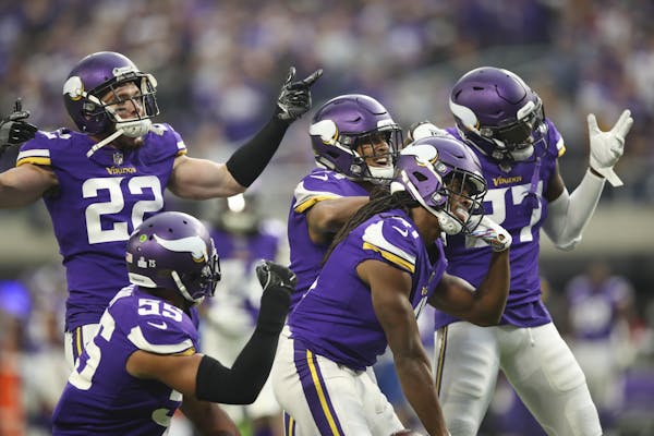 Minnesota Vikings teammates celebrated with defensive back Anthony Harris (41) after he intercepted a third quarter pass intended for Arizona Cardinal
