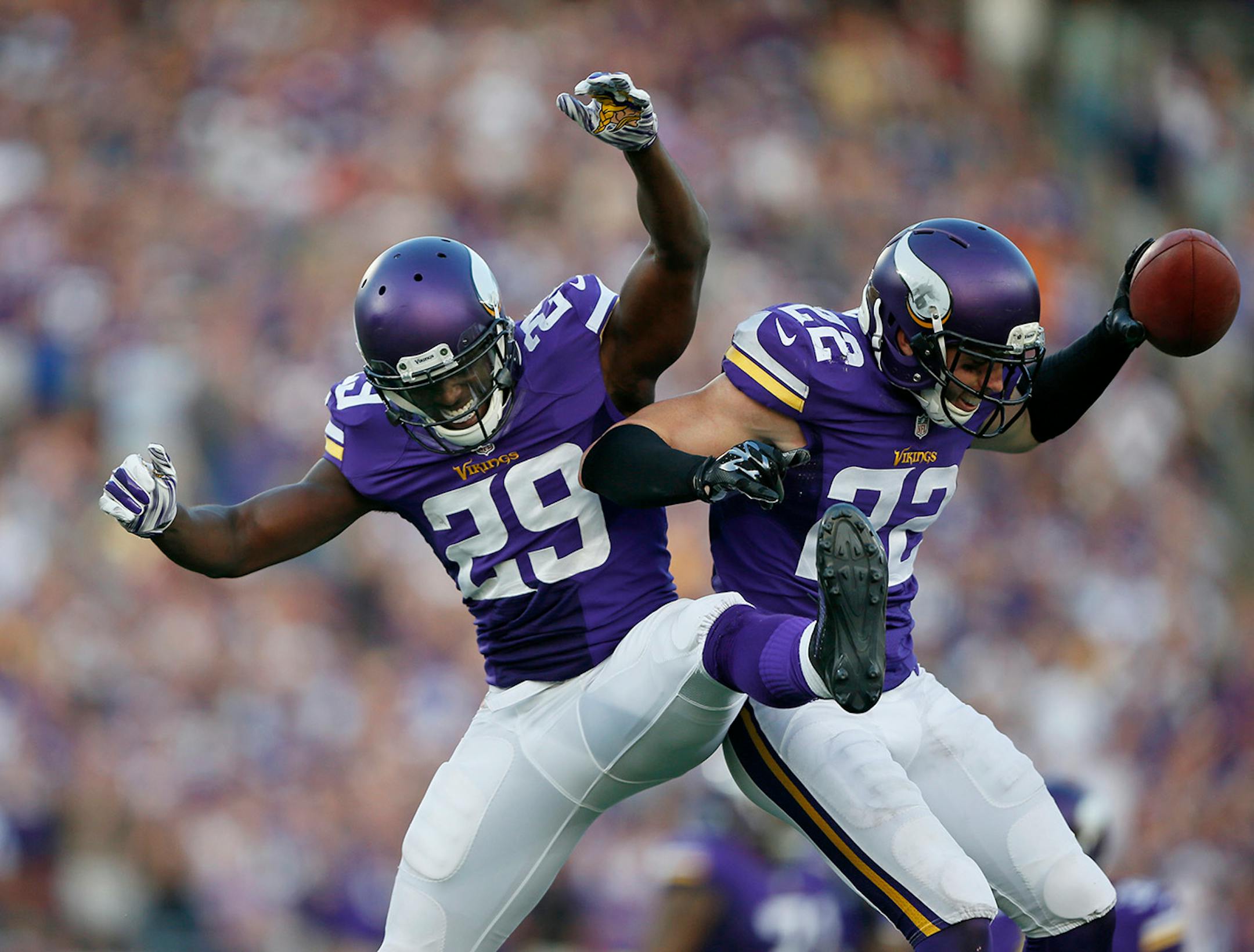 Minnesota Vikings cornerback Xavier Rhodes (29) and safety Harrison Smith celebrated an interception last year.