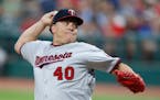Minnesota Twins starting pitcher Bartolo Colon delivers against the Cleveland Indians during the first inning in a baseball game, Tuesday, Sept. 26, 2