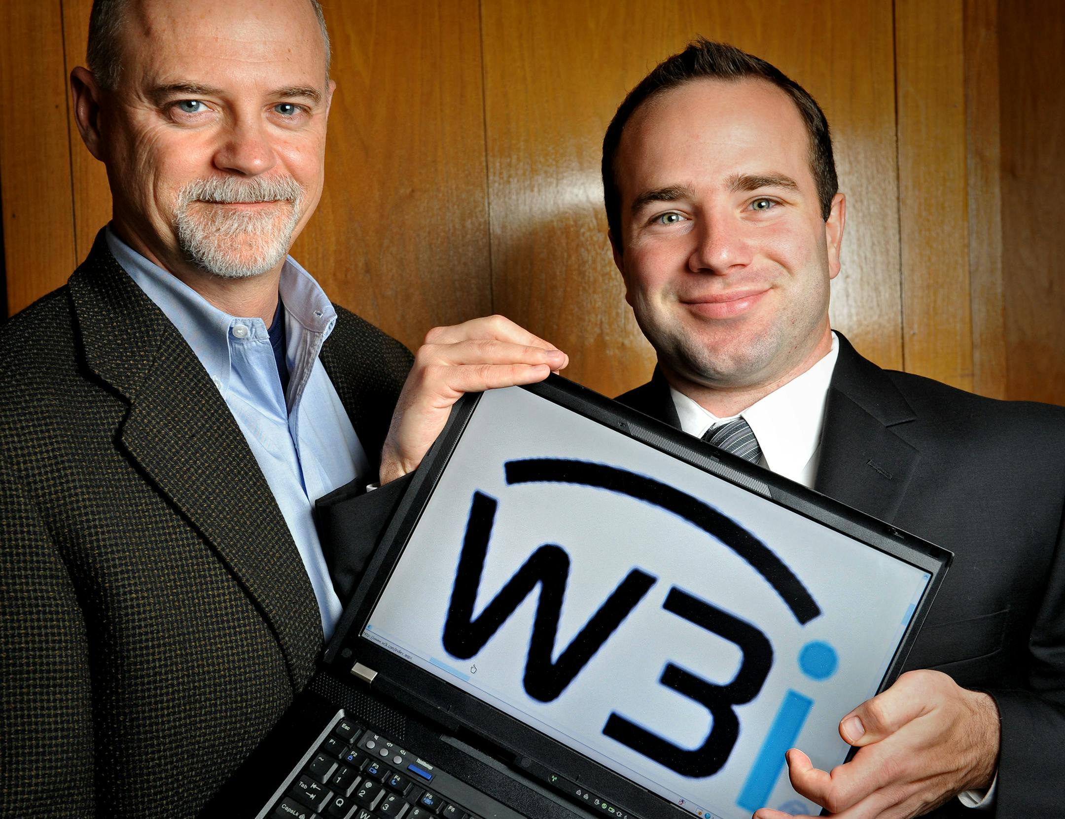 NativeX CEO Andy Johnson, left, and Rob Weber in a photo from 2008, when the company was called W3i.