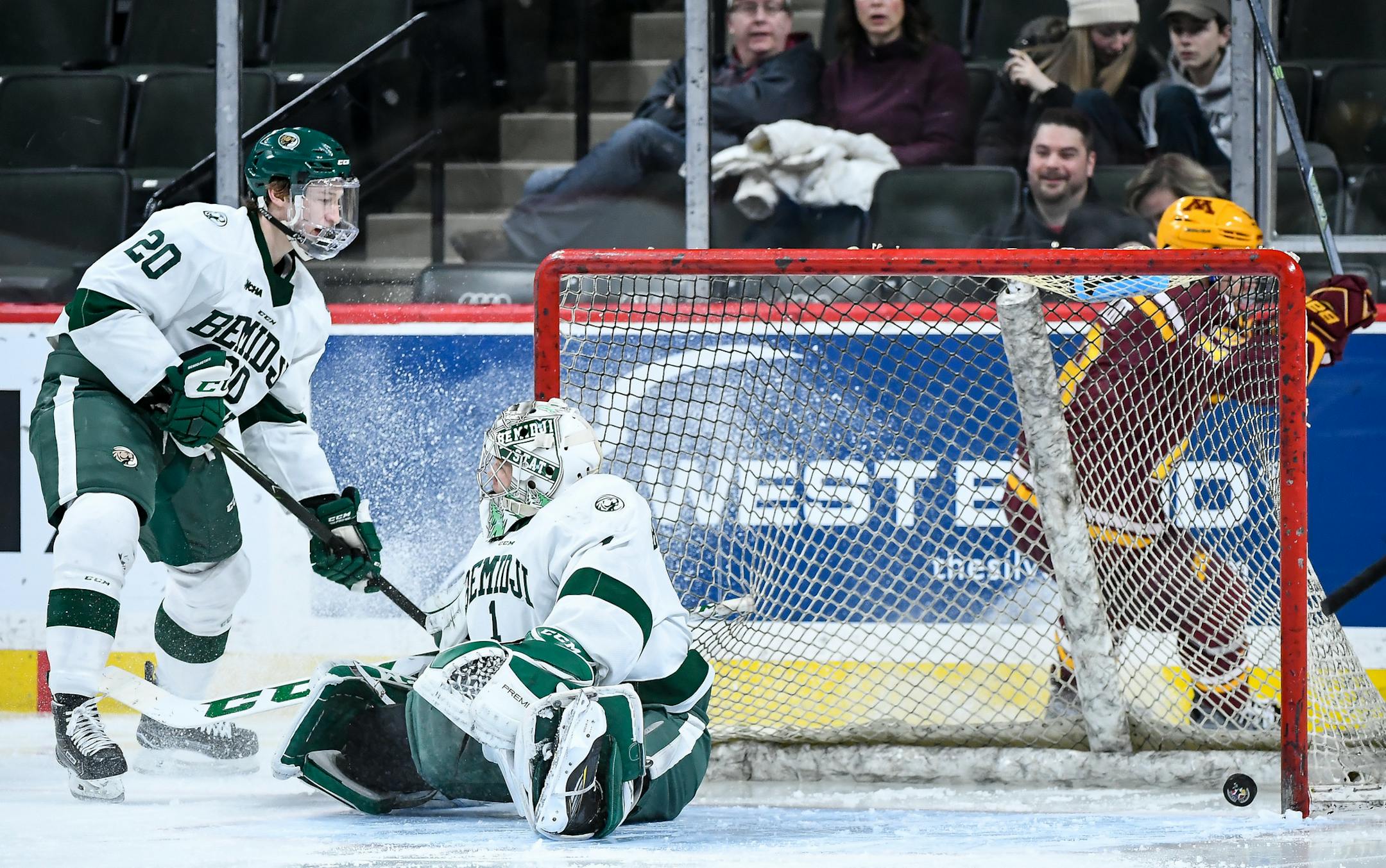 Minnesota Golden Gophers left wing Leon Bristedt (18) scored off a rebound from the boards despite the defense of Bemidji State Beavers defenseman Dillon Eichstadt (20) and goalie Michael Bitzer (1) in the first minute of the second period. ] AARON LAVINSKY • aaron.lavinsky@startribune.com The University of Minnesota Golden Gophers play the Bemidji State Beavers on Saturday, Jan. 28, 2017 at Xcel Energy Center in St. Paul, Minn.
