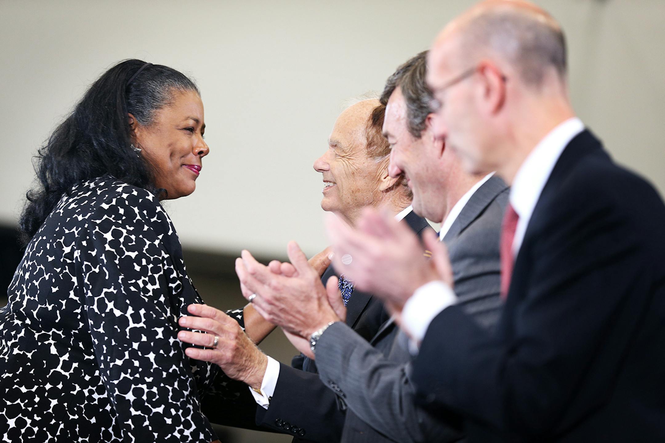 WNBA President Laurel Ritchie, left, shakes hands with Timberwolves and Lynx owner Glen Taylor during the grand opening event at the Timberwolves and Lynx Courts at Mayo Clinic Square in downtown Minneapolis on Wednesday, June 17, 2015.
