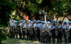 FILE -- U.S. Park Police officers near the White House on June 1, 2020, when hundreds of protesters were forcibly cleared from Lafayette Square before