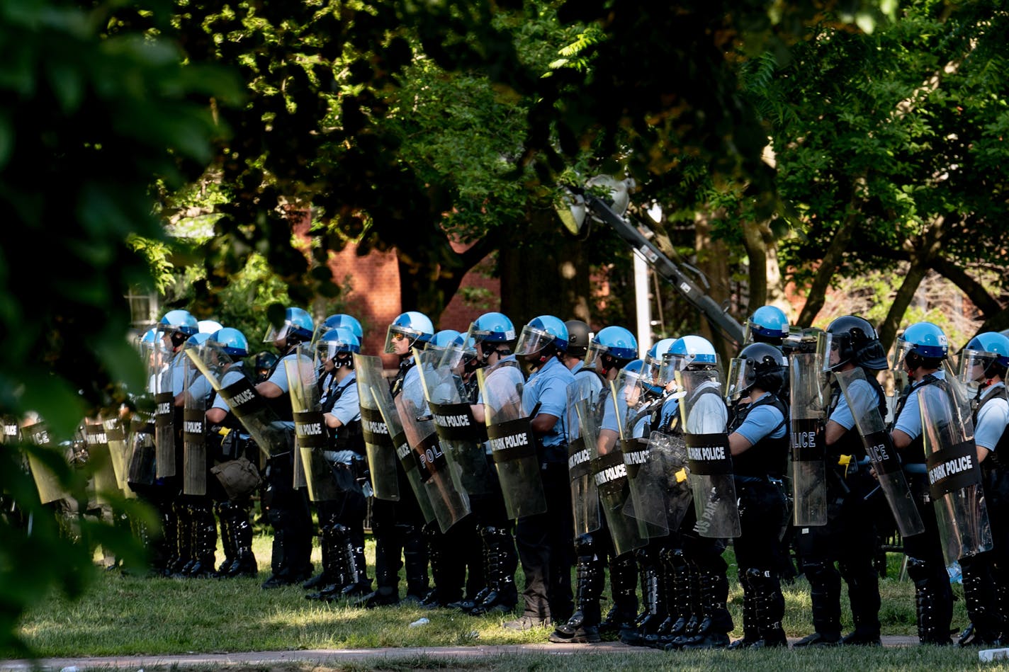 FILE -- U.S. Park Police officers near the White House on June 1, 2020, when hundreds of protesters were forcibly cleared from Lafayette Square before President Donald Trump's widely criticized visit to a nearby church. A top federal law enforcement official involved in the decision to forcibly clear hundreds of peaceful protesters near the White House was accused as a U.S. Park Police patrol officer nearly two decades ago of conducting unlawful body cavity searches and providing unreliable test