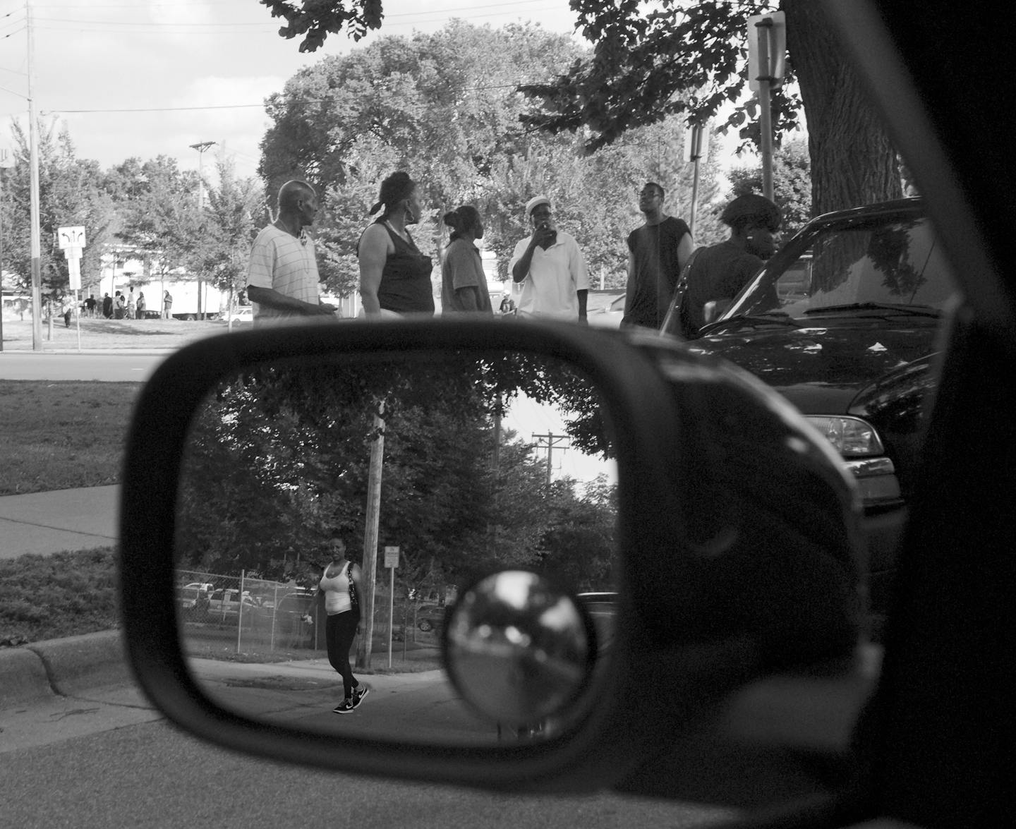 In a black-and-white photo, Laura Crosby interpreted a street gathering as &#x201c;Sex Trafficking Via the Rear View Mirror.&#x201d;