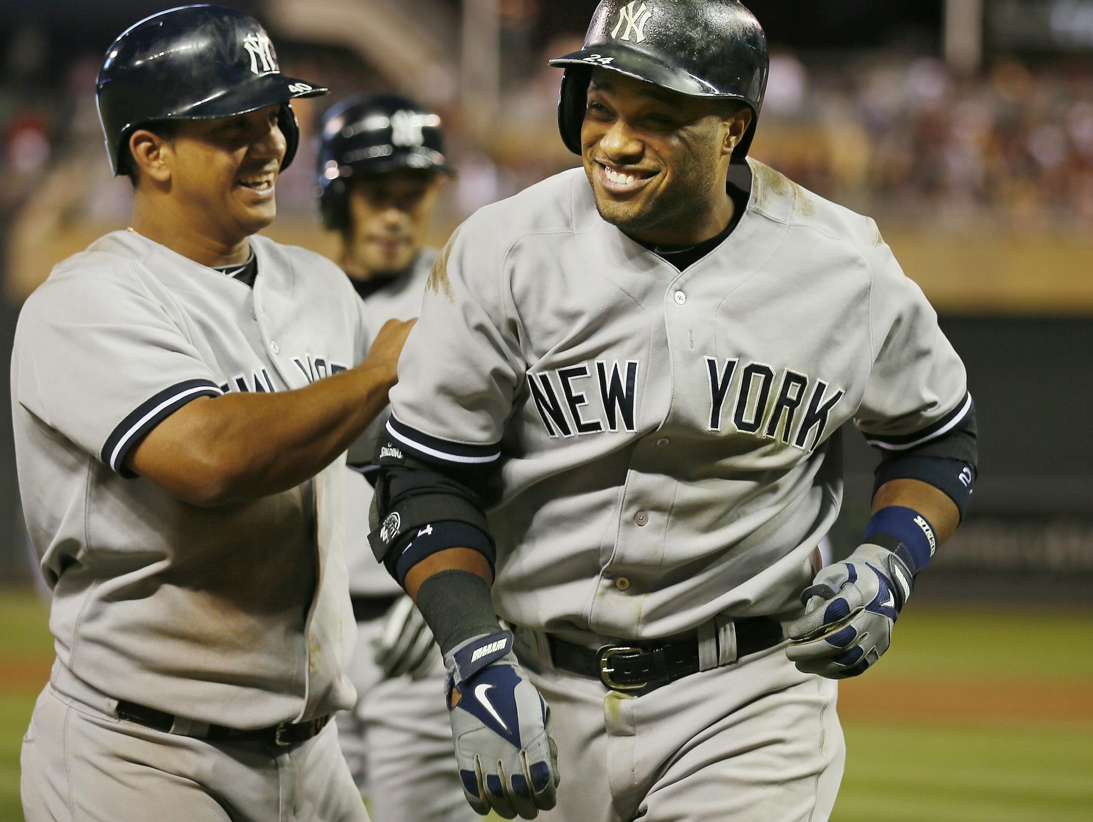 Robinson Cano, right, hit his third home run (a three-run shot) in two nights for the Yankees.