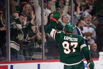 Minnesota Wild left wing Kirill Kaprizov (97) waved to fans on the glass after he scored in the second period of the game Thursday, Dec. 1, 2022 at Xc