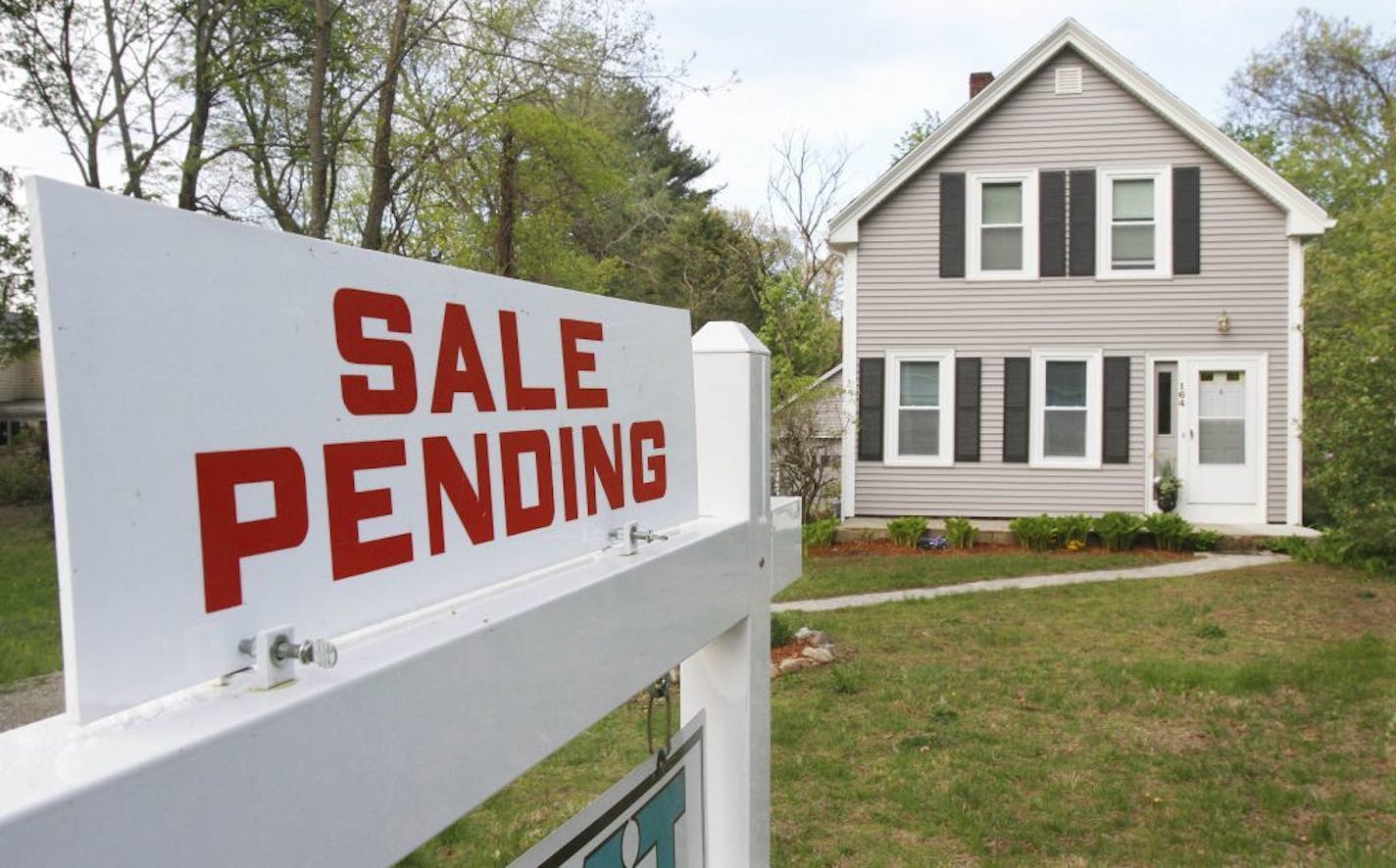 In this May 12, 2011 photo, a real estate sign announces a pending residential home sale in Wayland, Mass. Pending home sales fell in April with regional variations following increases in February and March, with unusual weather and economic softness adding to ongoing problems that are hobbling a recovery, according to the National Association of Realtors(R).