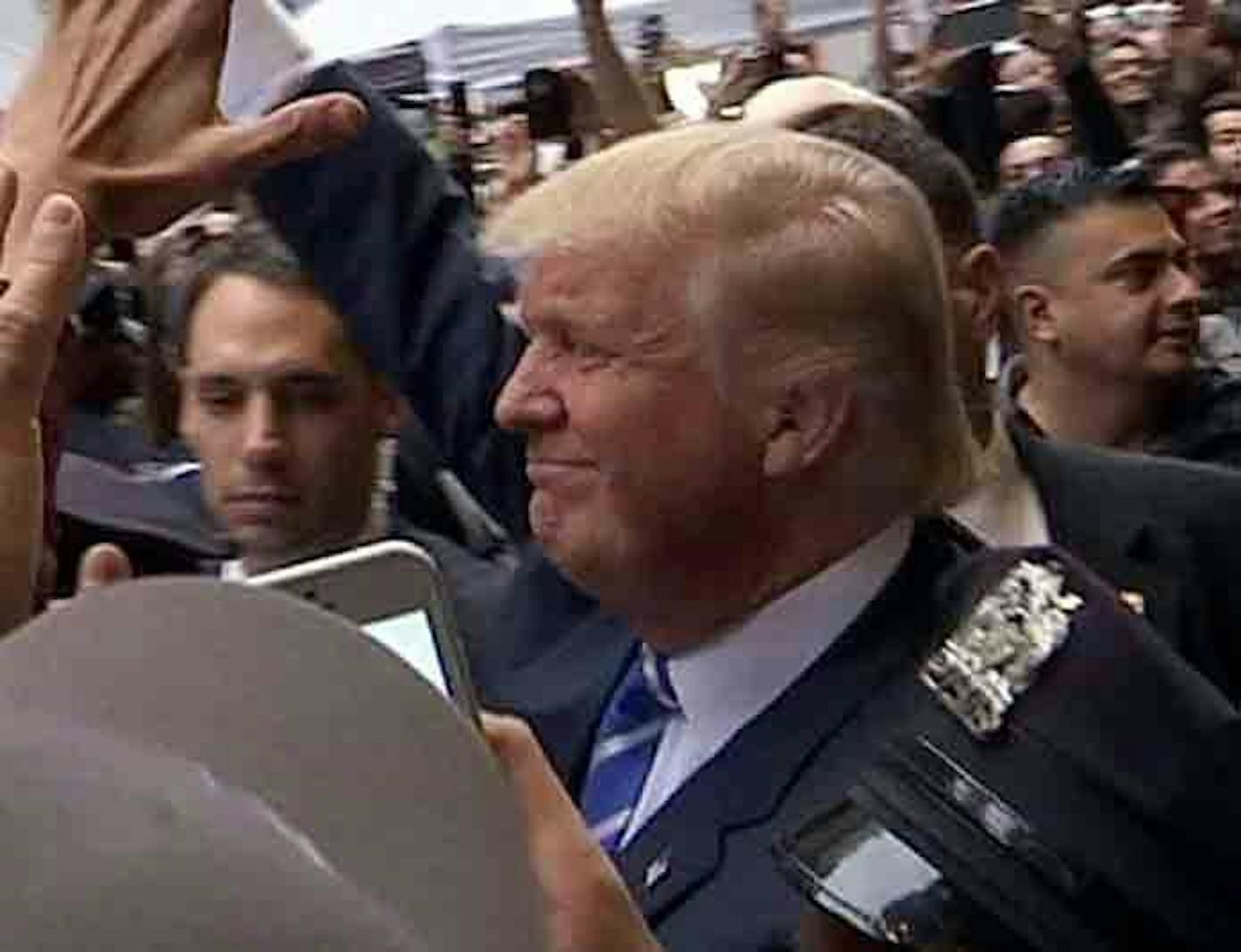 In this image from video, Donald Trump greeted supporters outside the Trump Tower in New York on Saturday. Trump insisted Saturday he would "never" abandon his White House bid.