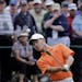 Amateur Guan Tianlang, of China, chips to the first green during the second round of the Masters golf tournament Friday, April 12, 2013, in Augusta, G