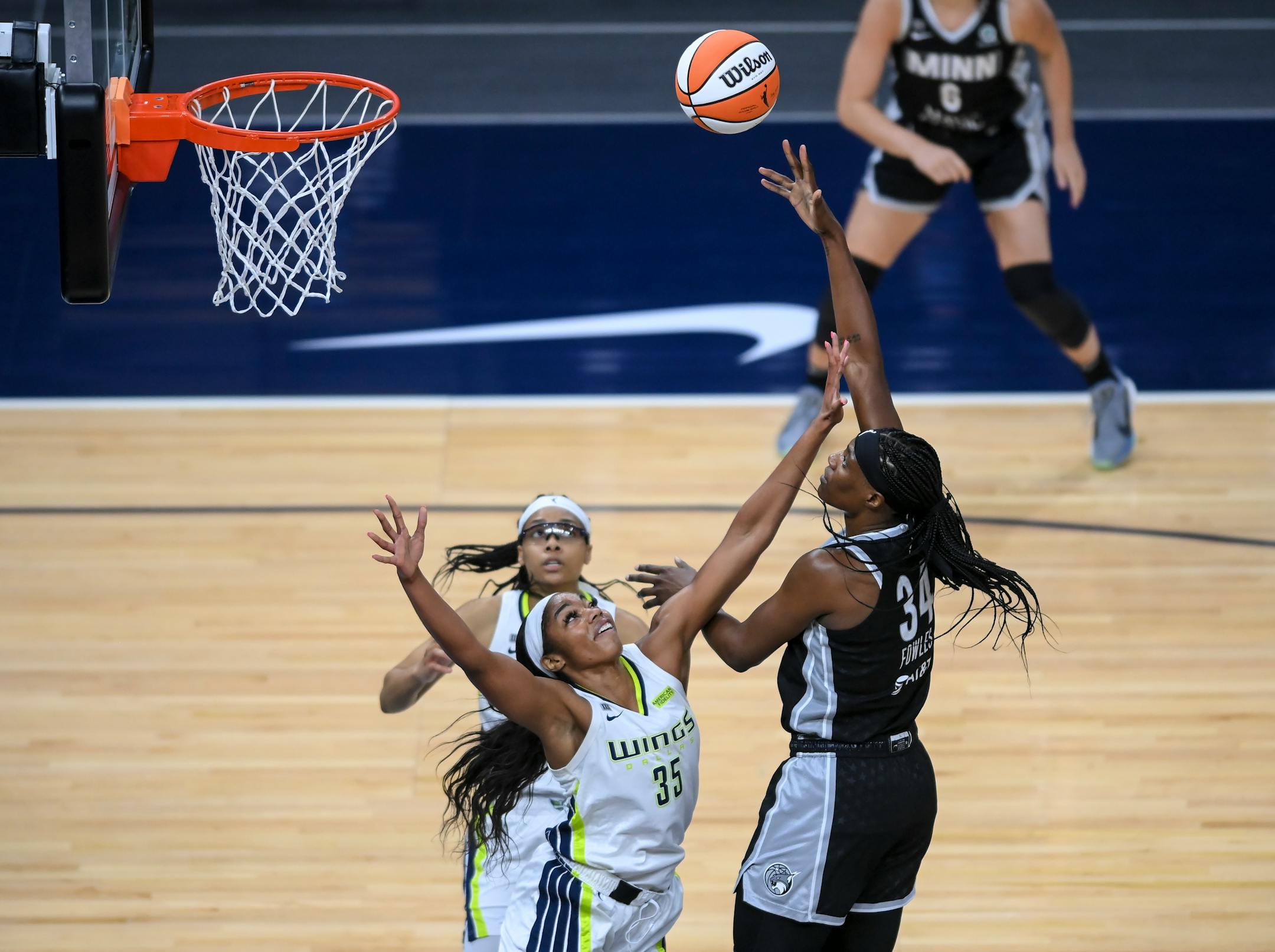 Minnesota Lynx center Sylvia Fowles (34) scored a basket over Dallas Wings Charli Collier (35) in the second half.