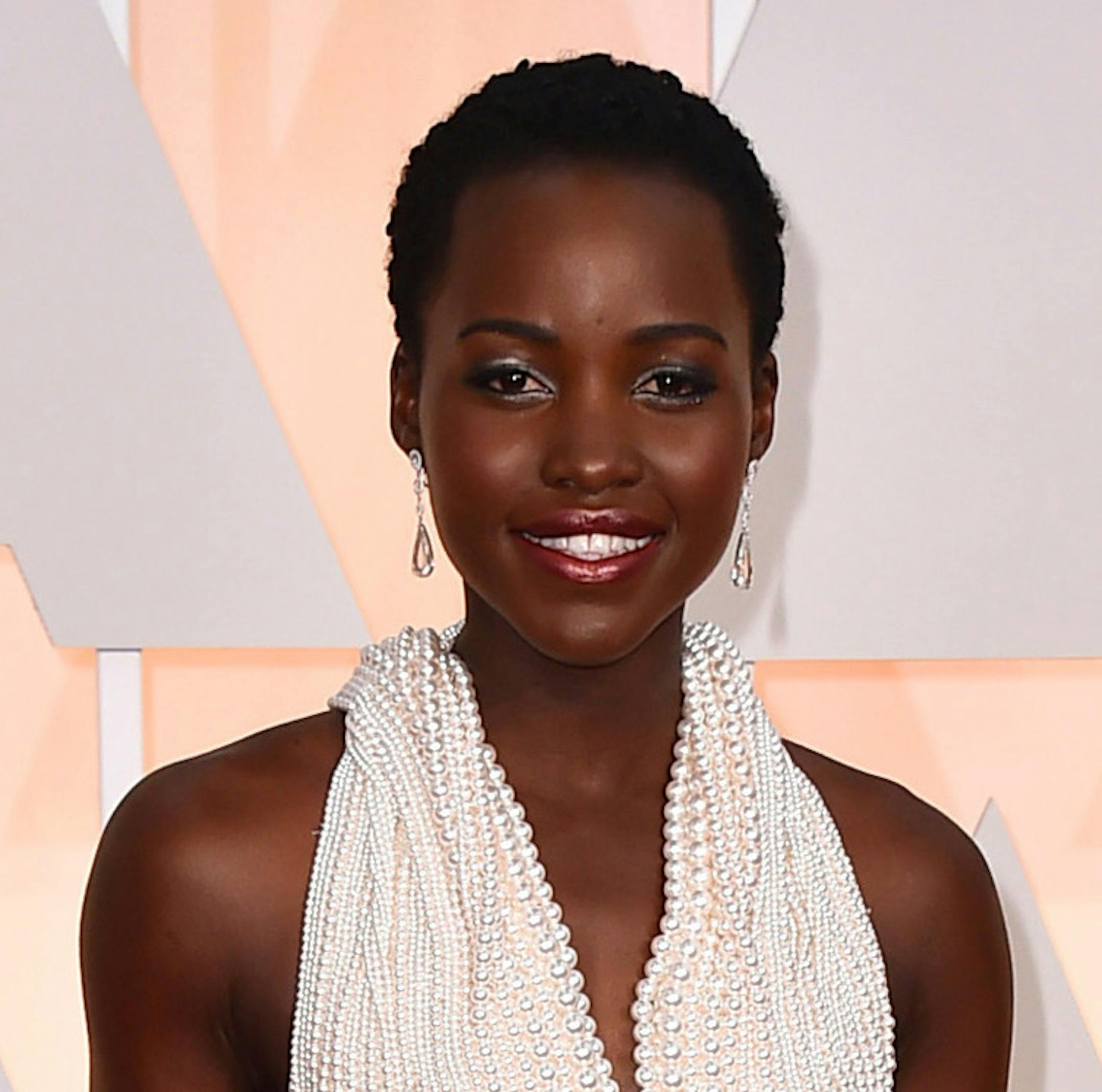 FILE - In this Sunday, Feb. 22, 2015 file photo, Lupita Nyong'o arrives at the Oscars at the Dolby Theatre in Los Angeles. Los Angeles sheriff's spokeswoman Nicole Nishida said on Friday, Feb. 27, 2015, that deputies have recovered a dress that "greatly resembles" the $150,000 custom Calvin Klein dress reported stolen from Nyong'o's hotel room earlier this week. (Photo by Jordan Strauss/Invision/AP, File)