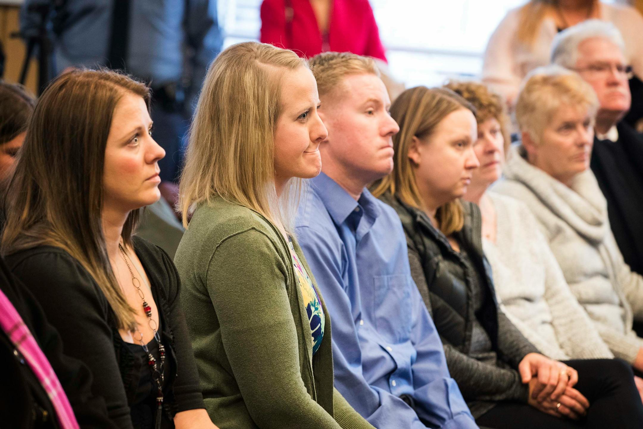 Cassie Hansen's family watches the ceremony, including her sisters Ashley Withrow, from right, and Brittany Koller. ] LEILA NAVIDI ï leila.navidi@startribune.com BACKGROUND INFORMATION: Thirty-six years after 6-year-old Cassie Hansen was kidnapped, strangled and left in dumpster, the team of officers and a civilian will be recognized for breaking one of St. Paul's most infamous murder cases during a ceremony at St. Paul Police Department's Western District office on Wednesday, December 13, 2017.