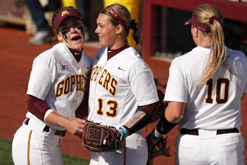 Gophers second baseman MaKenna Partain (3) congratulated pitcher Amber Fiser (13) during the 2019 season.