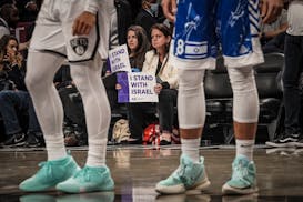 Fans displayed signs of support for Israel on Thursday in Brooklyn when the Nets played an exhibition game against Maccabi Ra’anana.