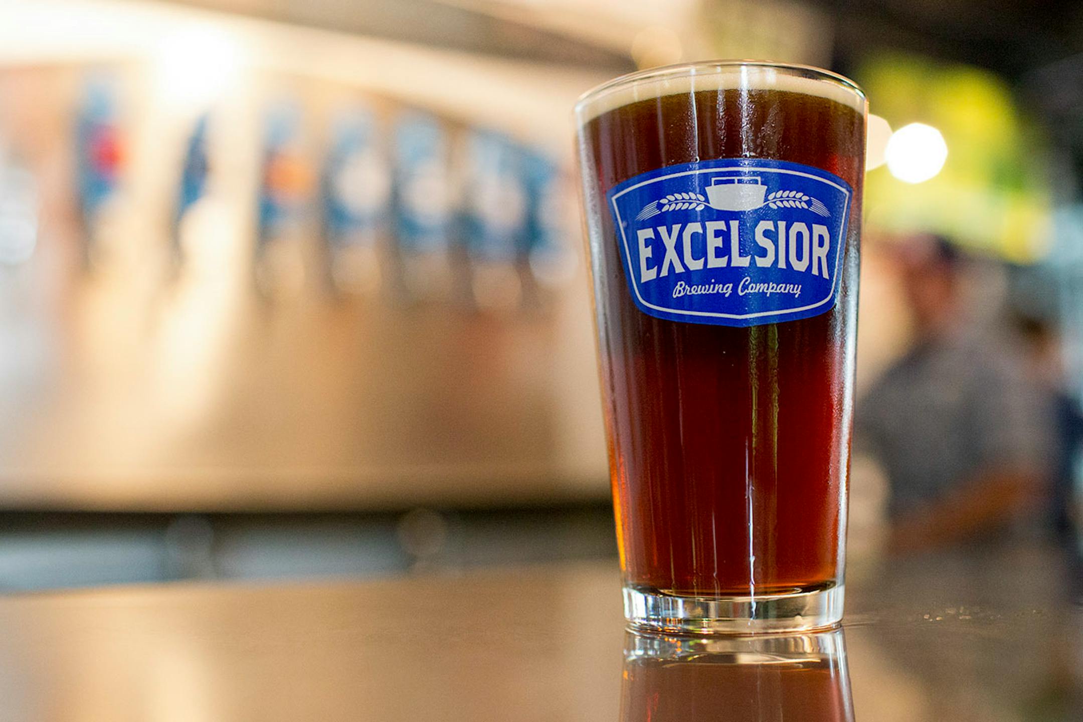 Excelsior Brewing Company's Amber Jack sits on the bar during the Crafts & Drafts Summer Craft Fair.