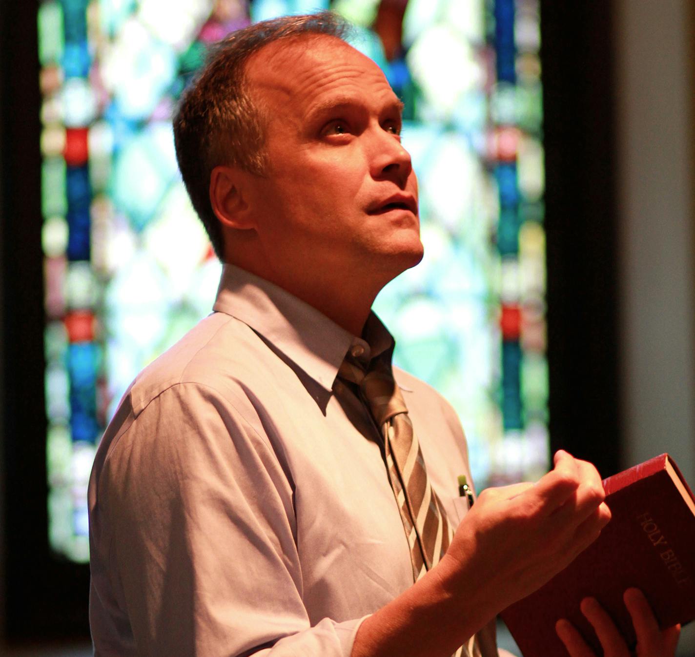 Andrew Erskine Wheeler as Pastor Paul in Walking Shadow Theatre Company's "The Christians." photo by Amy Rummenie