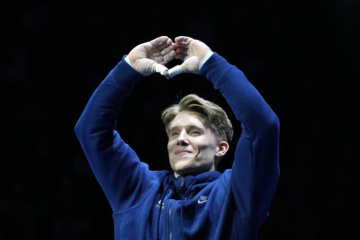 Former Gophers gymnast Shane Wiskus of Spring Park gestures to the Target Center crowd ahead of Day 2 of the U.S. Olympic trials in men's gymnastics o