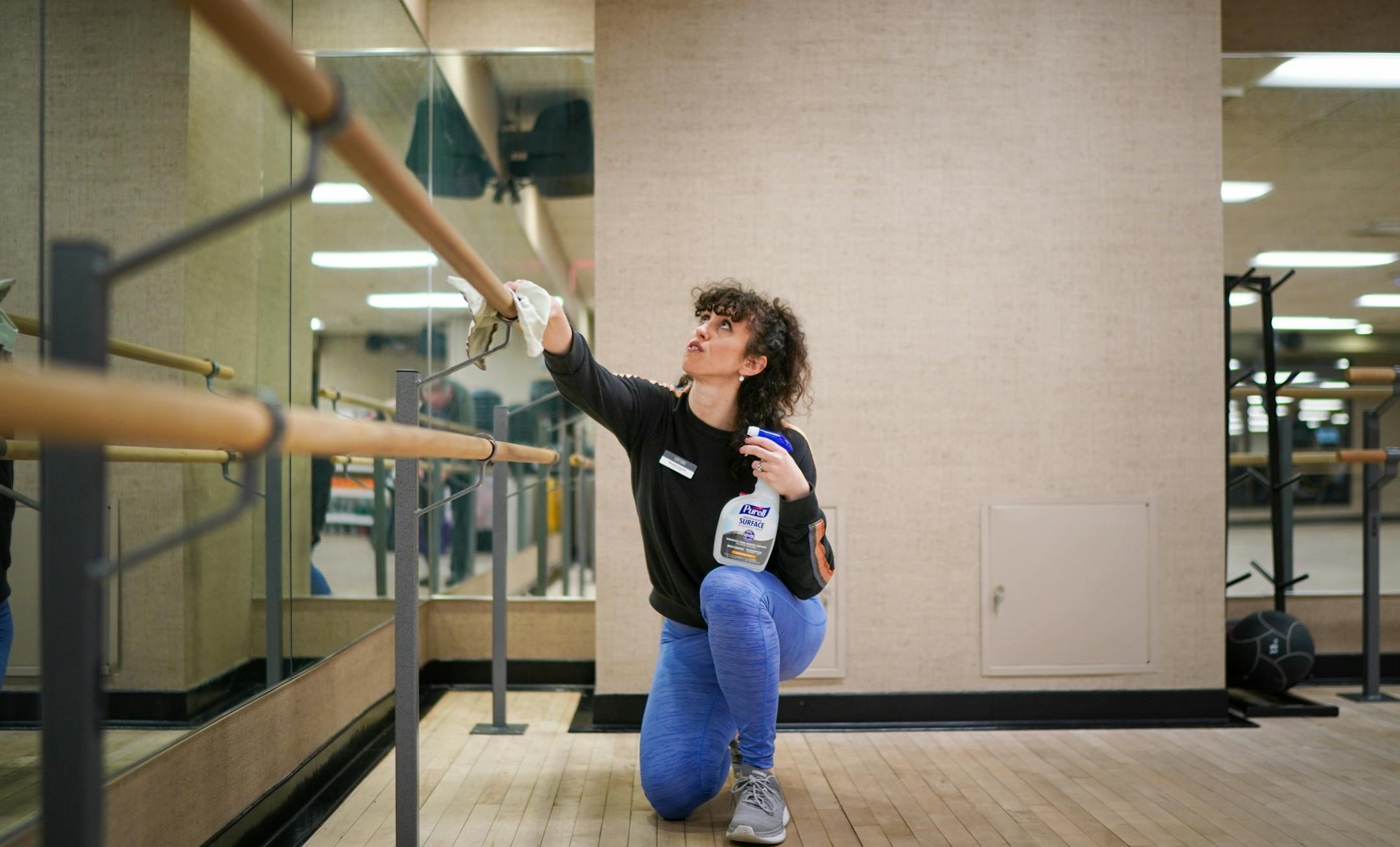 Studio manager Elizabeth Sousek cleaned cleaned the studio bars at Life Time Fitness with Purell surface disinfectant more frequently on surfaces around the club on March 11, 2020.