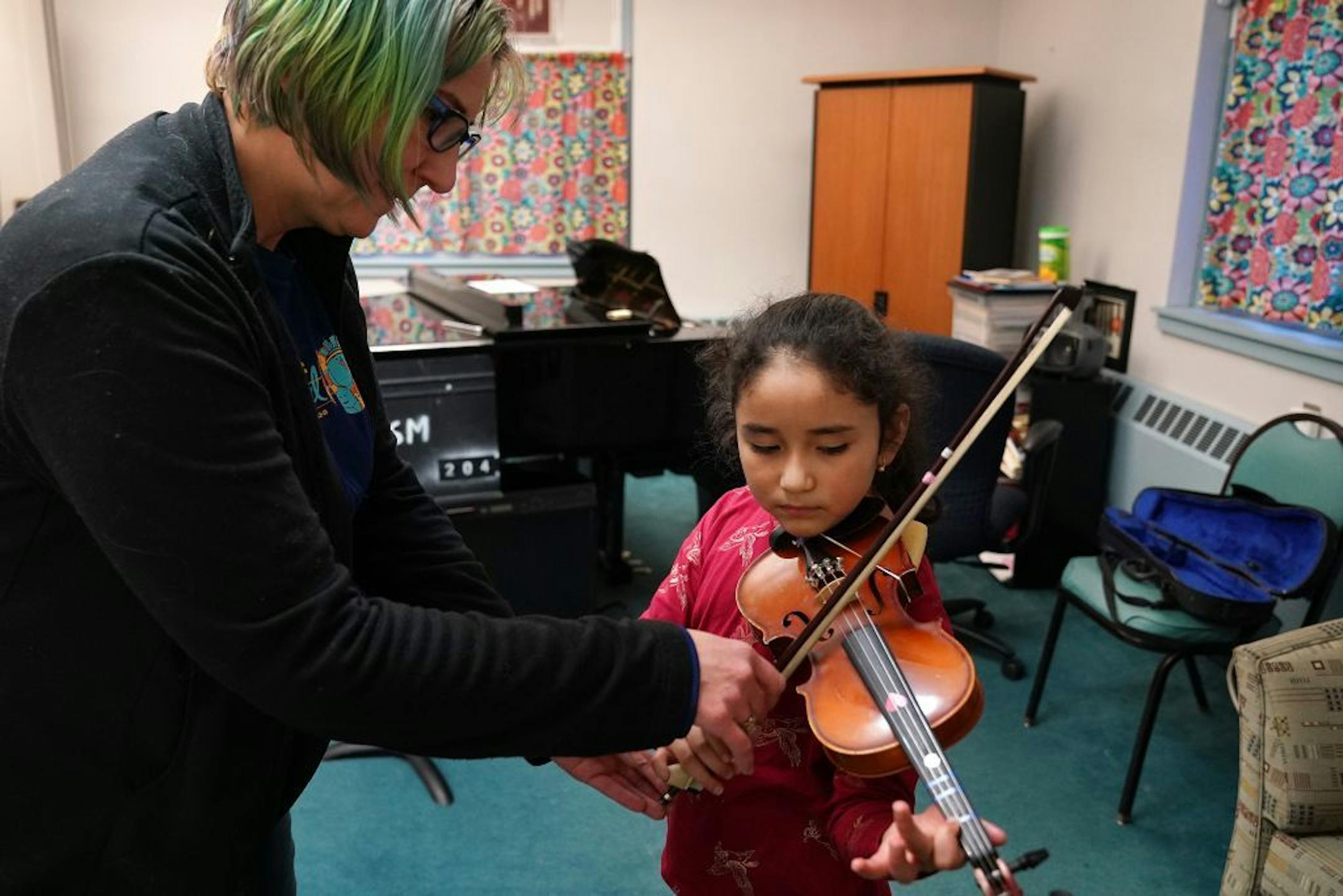 Instructor Ellie Fregni worked with Rafhaella Jimenez, 8, during her violin lesson Wednesday evening at Hopewell Music.