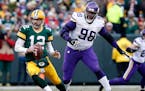 Vikings nose tackle Linval Joseph chased Packers quarterback Aaron Rodgers.
