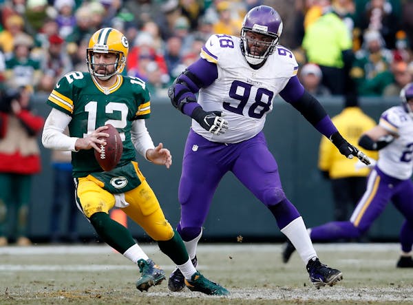 Vikings nose tackle Linval Joseph chased Packers quarterback Aaron Rodgers.