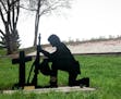 The Belle Plaine Veteran's Club had installed a monument depicting a kneeling soldier before a cross in the city's Veterans Memorial Park.