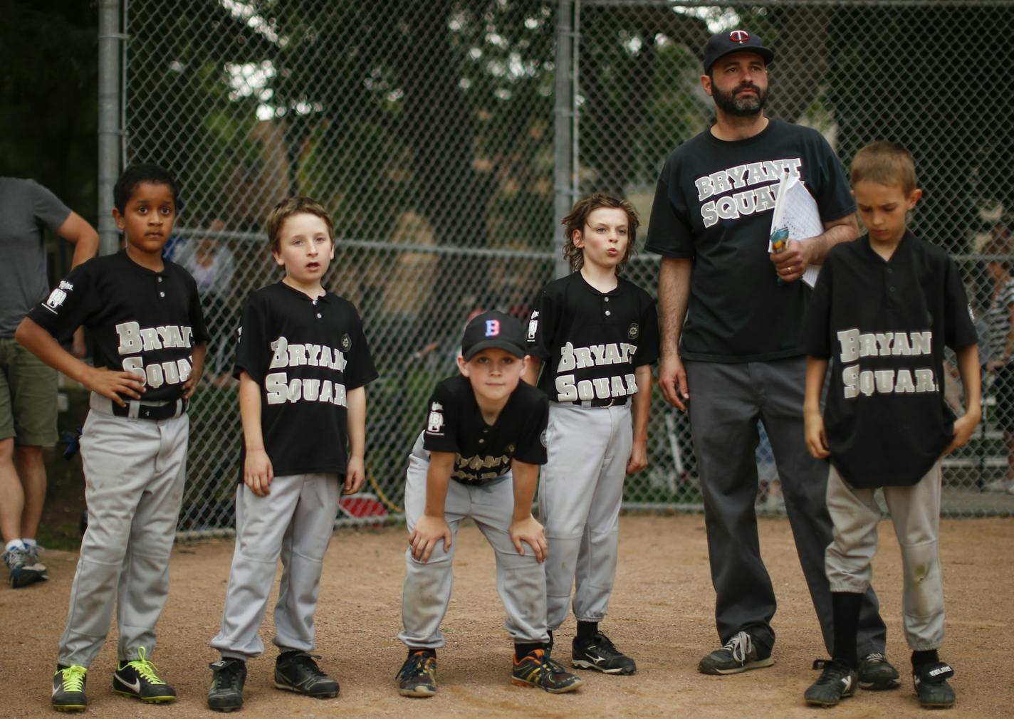 Because so many of his players struck out looking, Bryant Square head coach had his team run the length of the playground after their loss to Kenny Park last month. The players are, from left, Yaya Ahmed, 9, Jeremiah O'Connell, 8, Holden Magnuson, 9, Hollis Vanderah, 9, and Levi McCabe Johnston, 8, waited for the rest of their teammates to finish before rehashing the game. ] JEFF WHEELER &#x201a;&#xc4;&#xa2; jeff.wheeler@startribune.com Bryant Square Park rec center little league team had a game