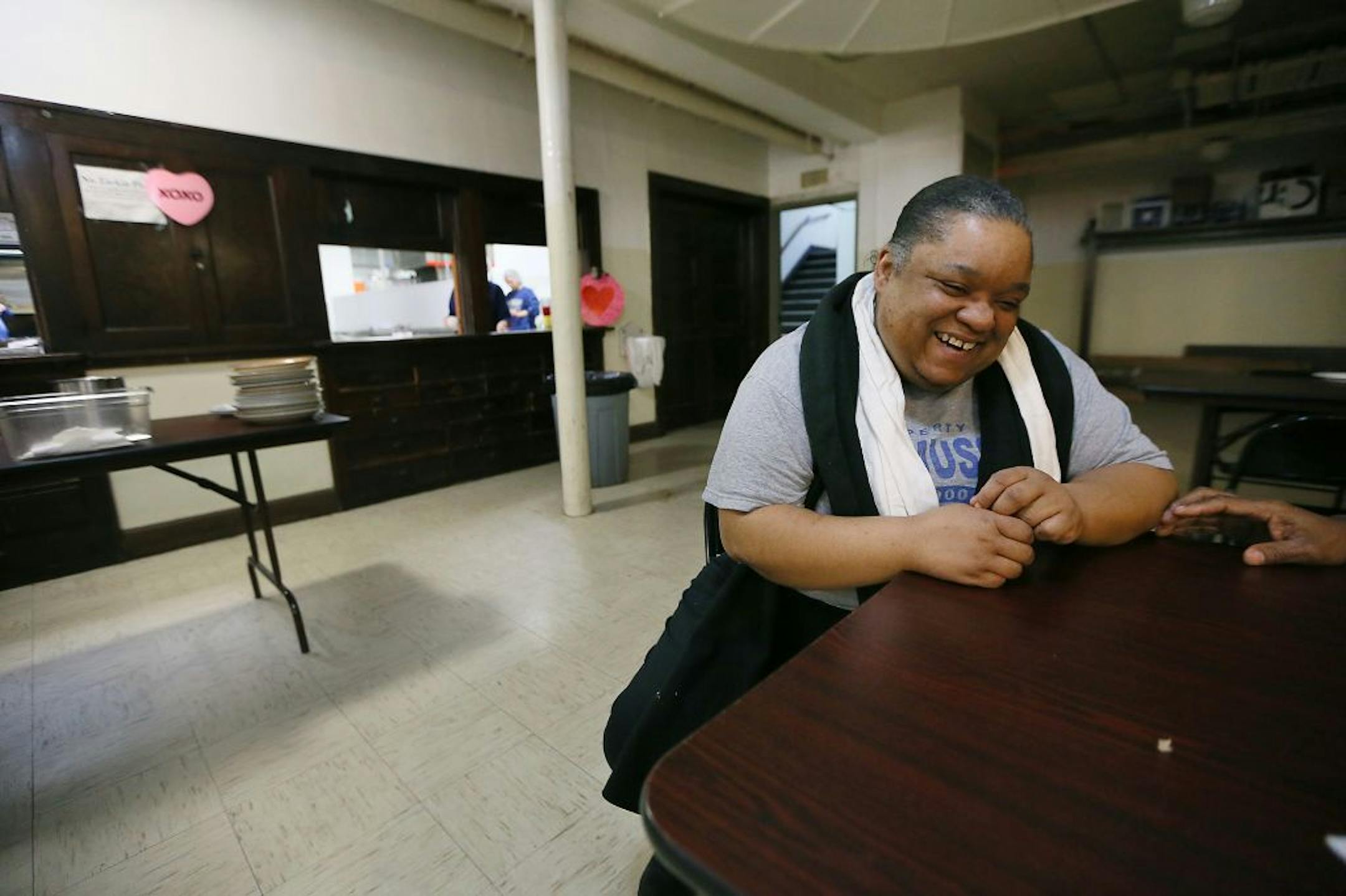 Mandisha Kelley took a few minutes to chat with a another resident after breakfast at the Simpson Housing Shelter, Friday, February 12, 2016 in Minneapolis, MN.