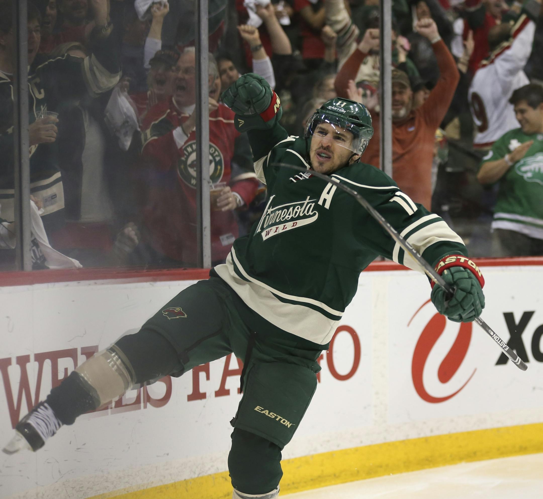 Minnesota Wild left wing Zach Parise (11) celebrated his third period goal and second of the game Sunday afternoon.