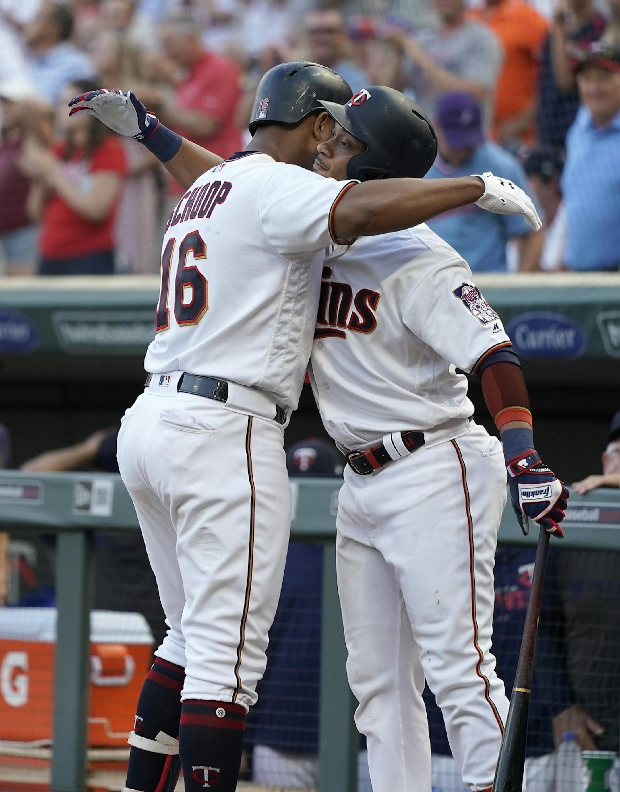 Minnesota Twins second baseman Jonathan Schoop (16) celebrates his home run with Minnesota Twins shortstop Jorge Polanco (11) during the third inning.
