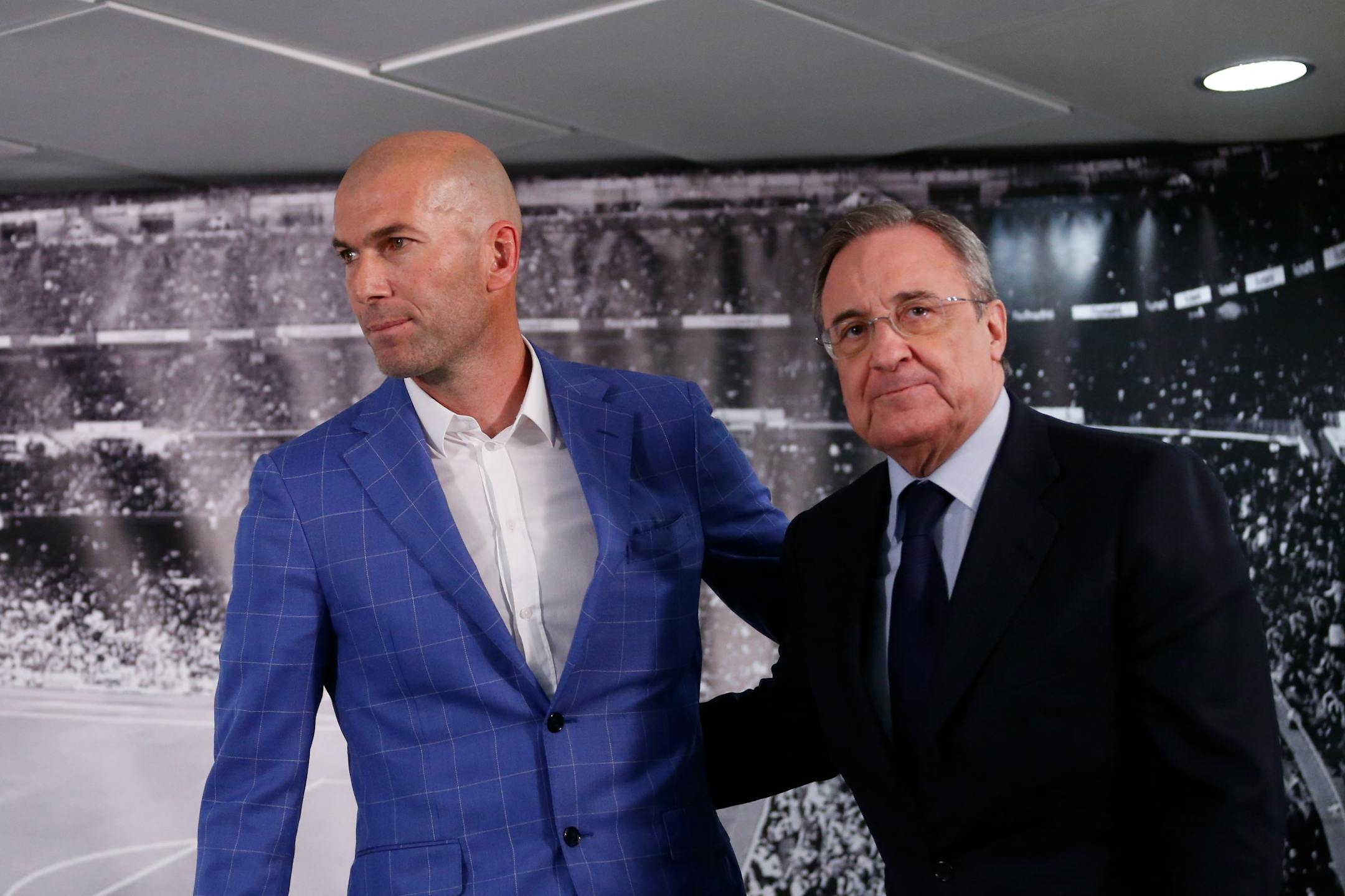 Real Madrid's President Florentino Perez, right, stood with newly appointed coach Zinedine Zidane at the Santiago Bernabeu stadium in Madrid on Monday. Real Madrid fired coach Rafael Benitez after seven months and replaced him former player Zidane a day after Madrid's 2-2 draw at Valencia deepened a crisis that started with an embarrassing 4-0 home loss to rival Barcelona in November.