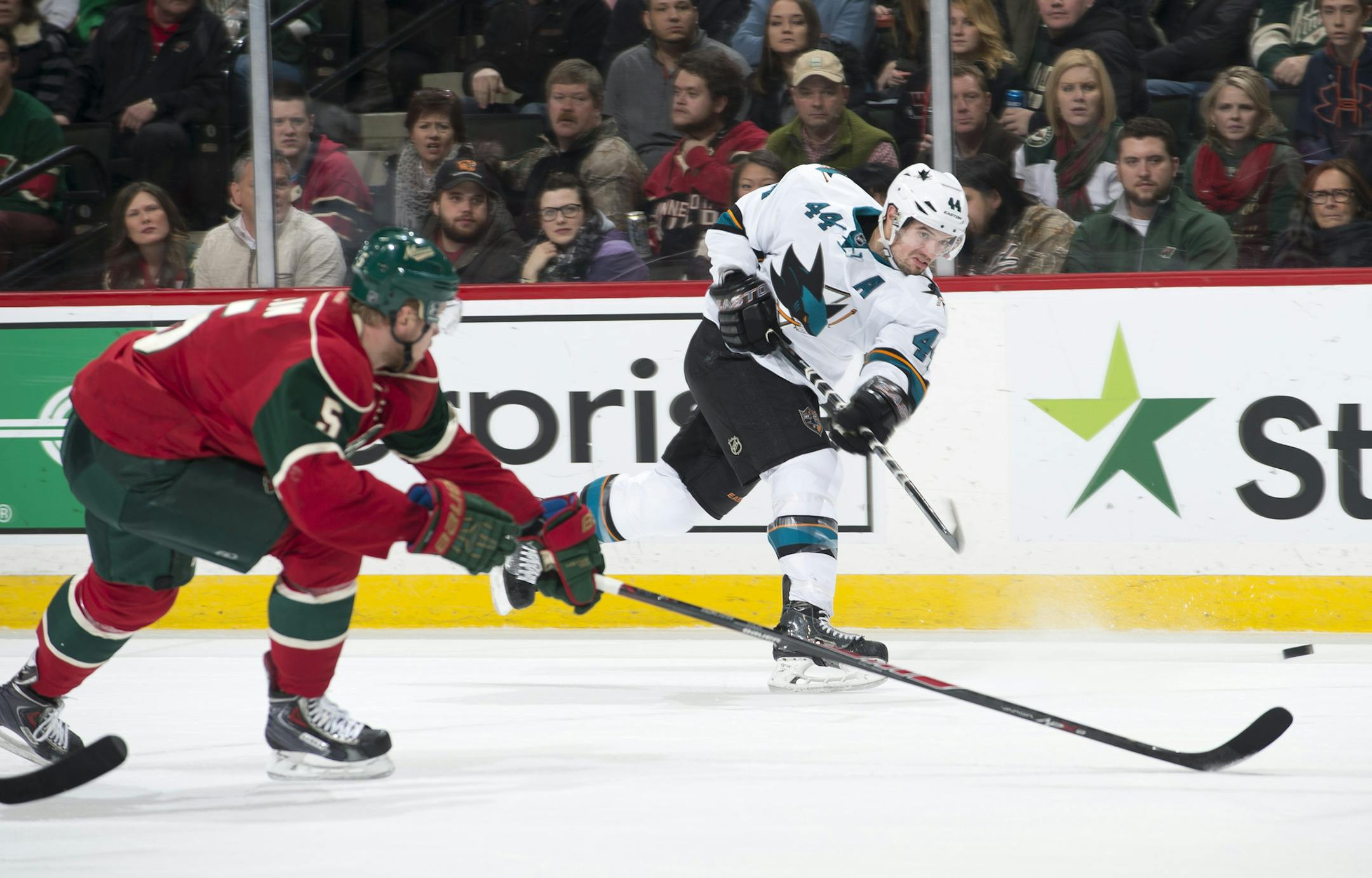 San Jose Sharks defenseman Marc-Edouard Vlasic (44) gets off a shot while being defended by Minnesota Wild defenseman Christian Folin (5) in the final seconds of overtime on Tuesday night. ] (Aaron Lavinsky | StarTribune) The Minnesota Wild take on the San Jose Sharks Tuesday, Jan. 6, 2014 at Xcel Energy Center in St. Paul.
