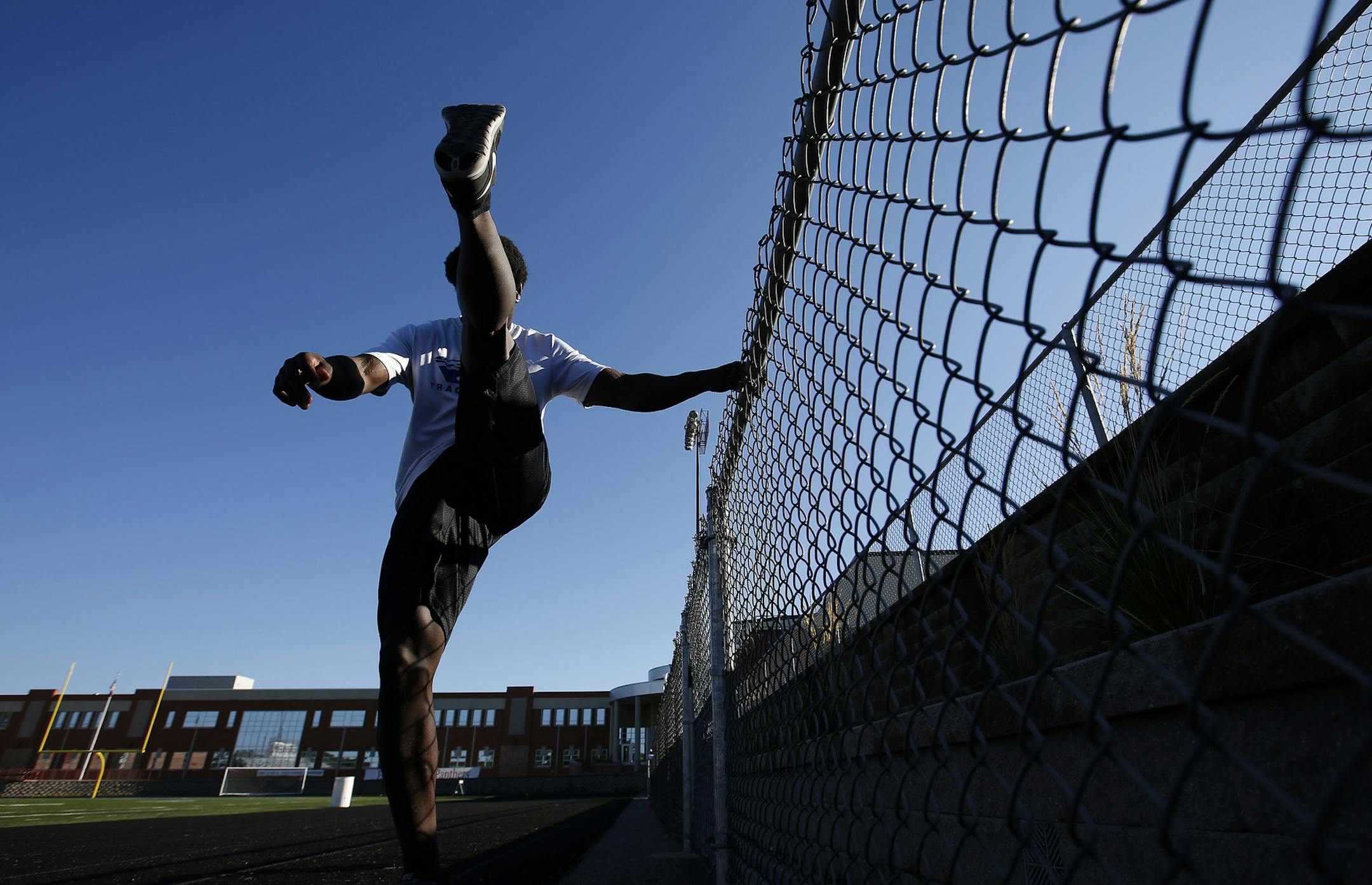 A Spring Lake Park player stretched out during the first day of football practice on Monday. ] CARLOS GONZALEZ cgonzalez@startribune.com - August 10, 2015, Spring Lake Park, MN, First day of Prep / High School football practice