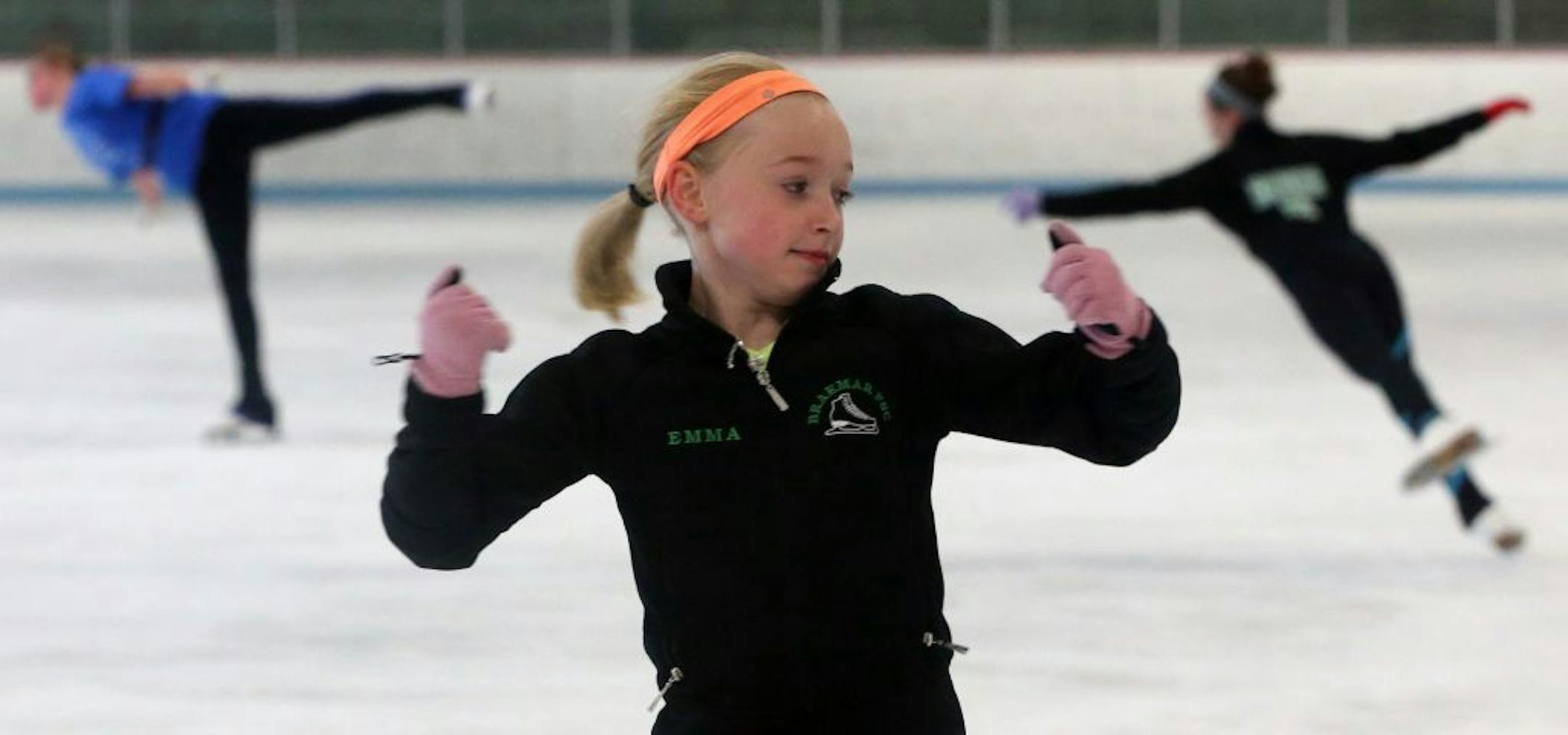 Emma Richards, 10, practiced with her coach, Sarina David, at one of the rinks at Braemar Arena in Edina on 7/18/13.