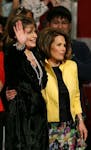 Palin and Bachmann ­during Wednesday's rally at the Minn­eapolis Convention Center.