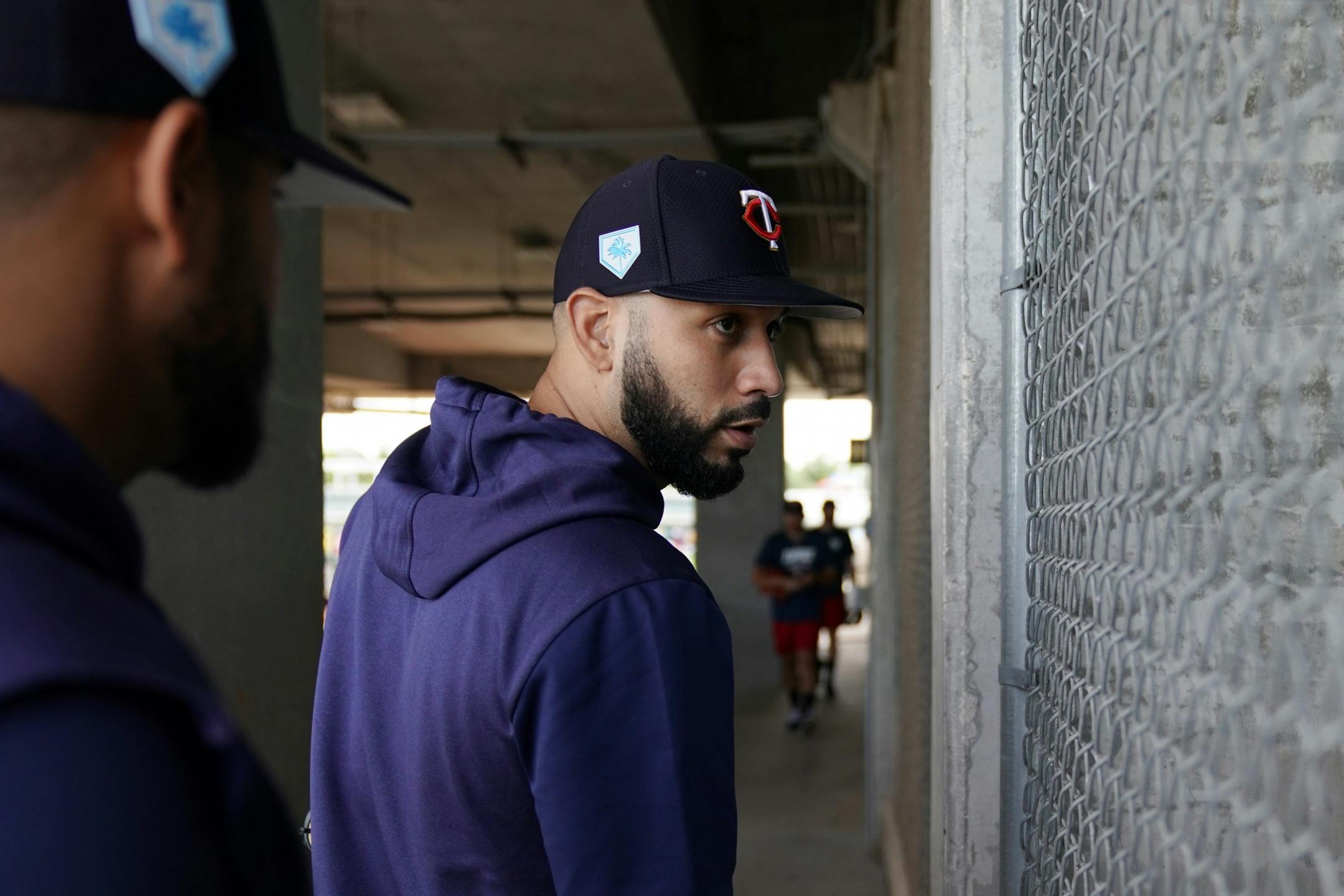 Newly acquired Minnesota Twins utility player Marwin Gonzalez (9) stopped to watch the Baltimore Orioles batting practice after he joined his teammates on the practice field for workouts Monday morning.
