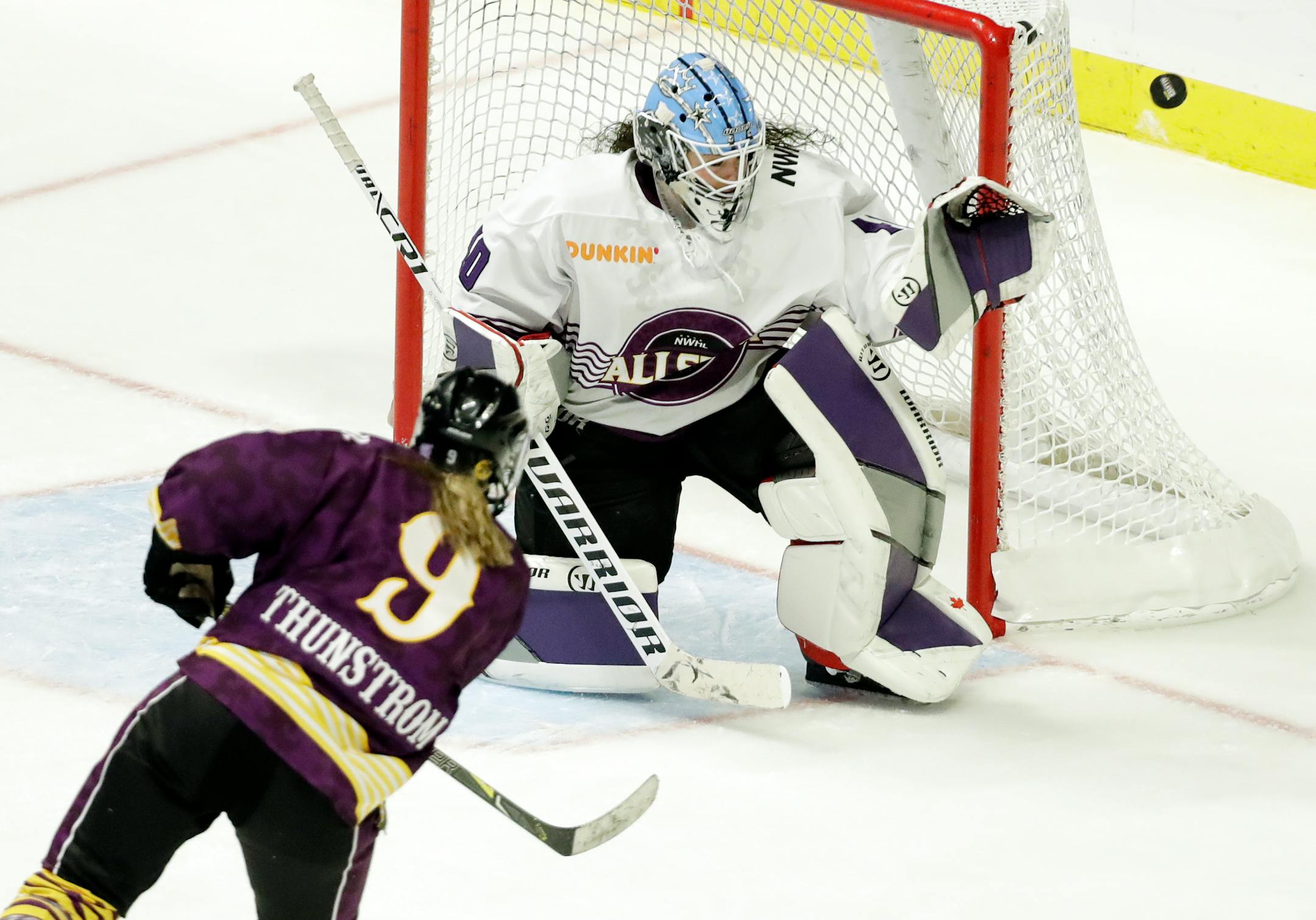 Team Stecklein forward Allie Thunstrom (9) shoots against Team Szabados goalie Shannon Szabados in the NWHL All-Star Hockey Game Sunday, Feb. 10, 2019, in Nashville, Tenn. (AP Photo/Mark Humphrey)