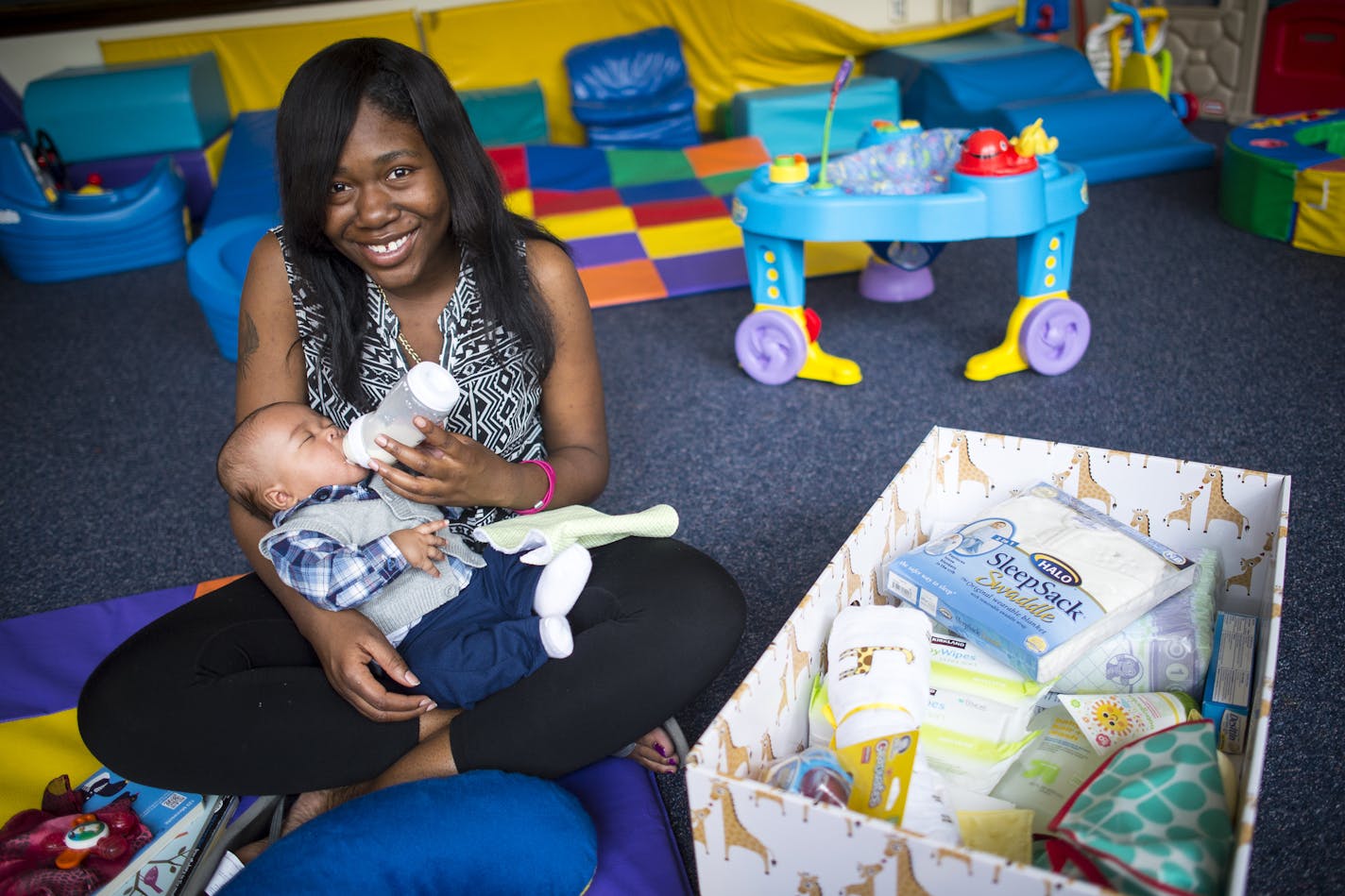 At top, Herbanae Scott with her 3-month-old son, Odell. She said he liked sleeping in &#x201c;the cozy and confined space.&#x201d;