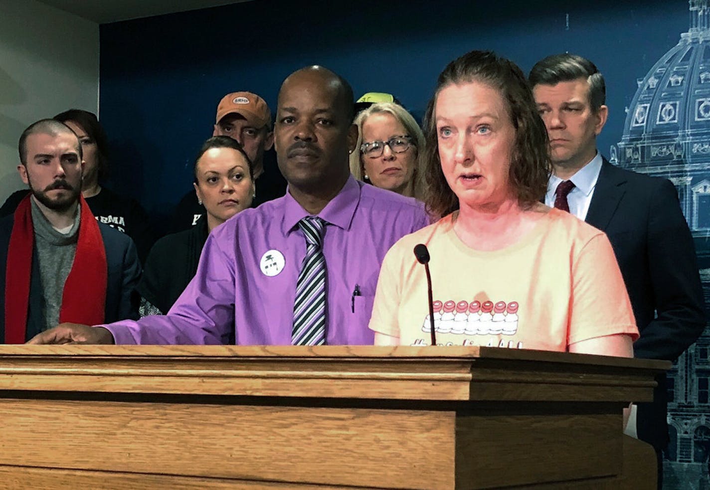 Nicole Smith-Holt, right, and James Holt Jr., left, were among the Minnesotans who showed up at the State Capitol on Tuesday to back drug price control measures in the House that Democrats say would lower costs and increase transparency in the pharmaceutical industry.