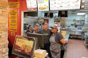 Taco John’s in the downtown Minneapolis skyway closed for good Friday. Employees, who learned about the closing Wednesday, gathered Friday just befo